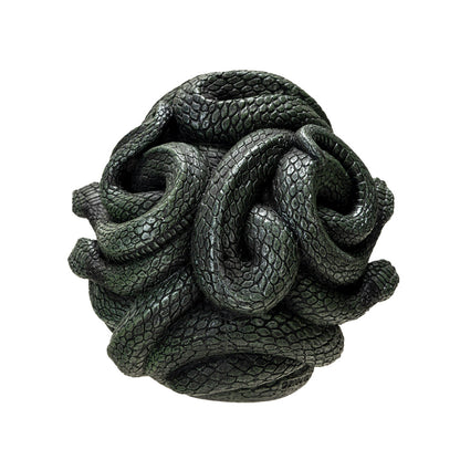 Back view of serpent skull sculpture showing coiled snake details
