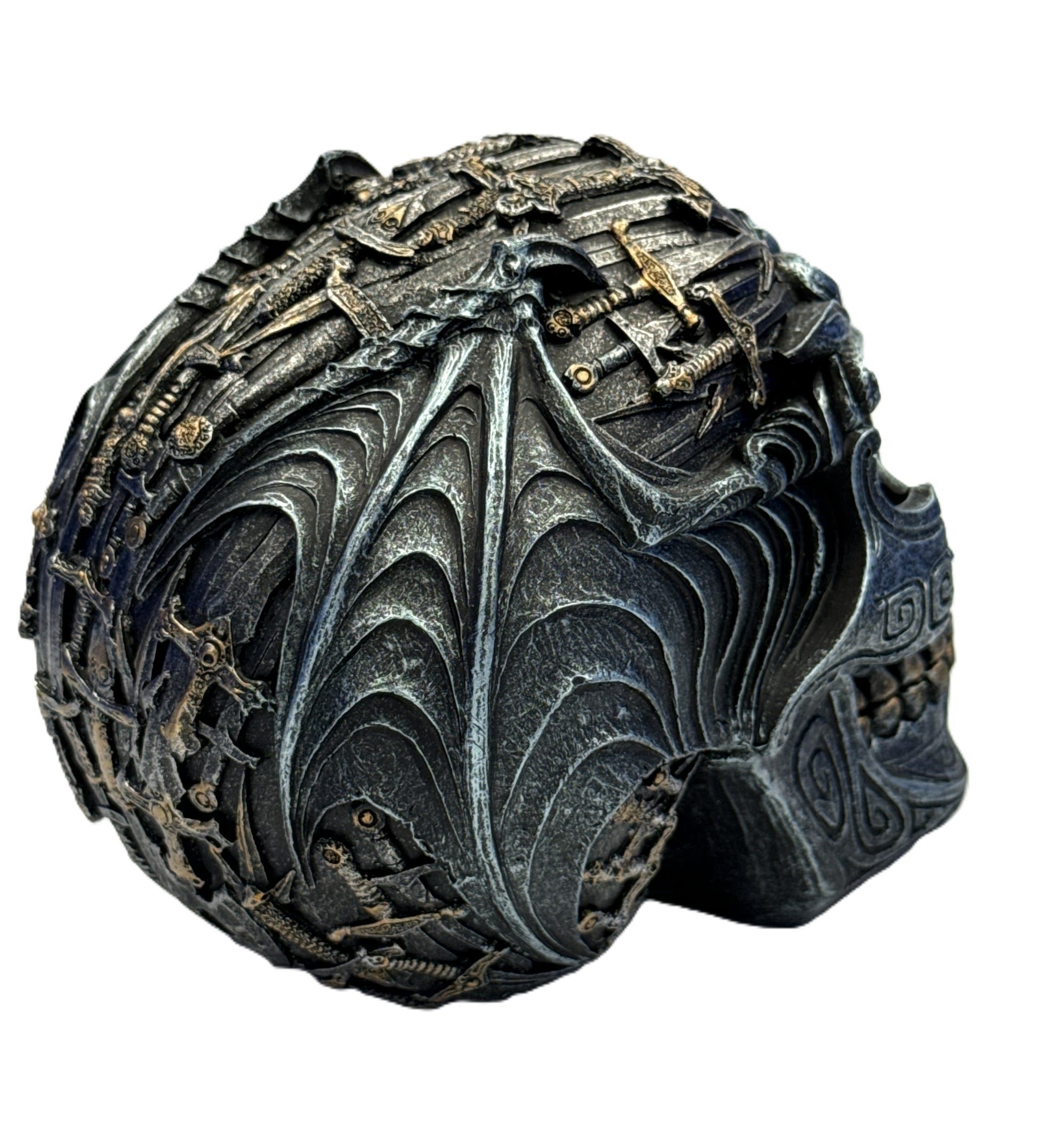 Rear angled view of gothic skull decor highlighting wing-like patterns and embedded weapon detailing
