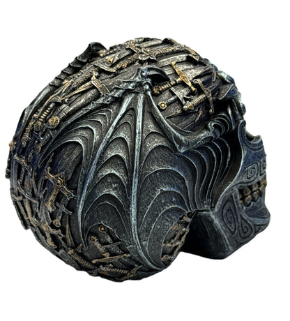 Rear angled view of gothic skull decor highlighting wing-like patterns and embedded weapon detailing
