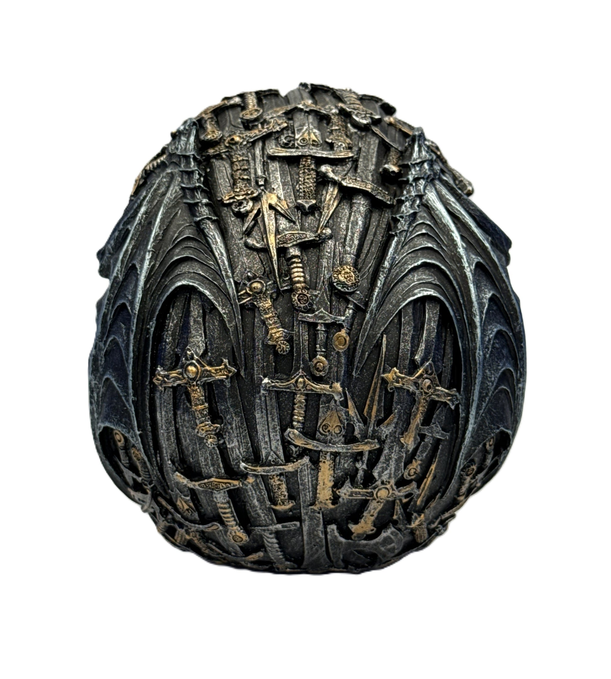 Back view of skull sculpture showcasing layered swords and intricate gothic texture details
