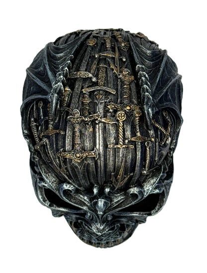 Top view of skull decor displaying layered swords and detailed gothic textures across the crown
