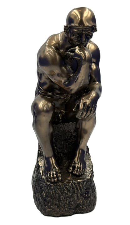 Front view of The Thinker sculpture highlighting the iconic pose with chin resting on hand

