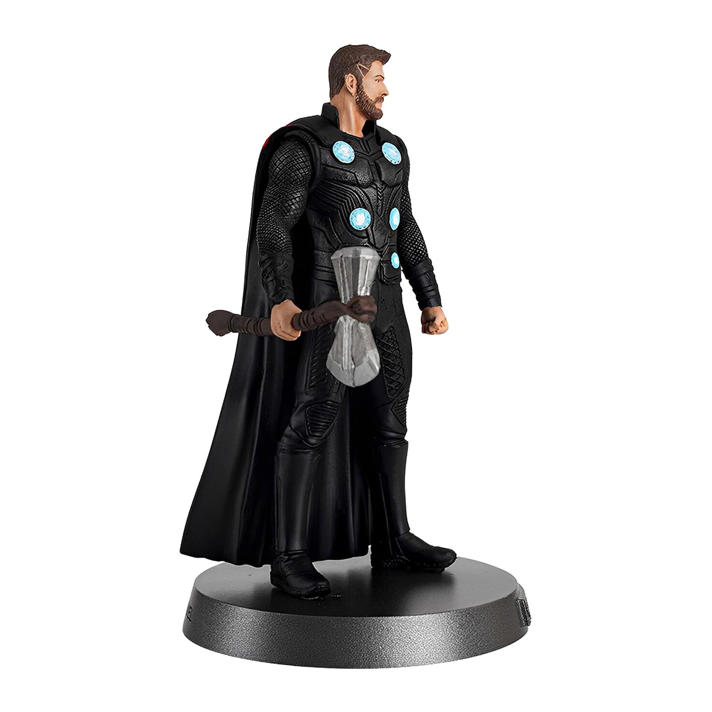 side profile of Thor metal statue with cape and axe
