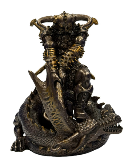 Front view of Thor Norse god statue standing over dragon with sword and detailed Viking armor in cold cast bronze finish
