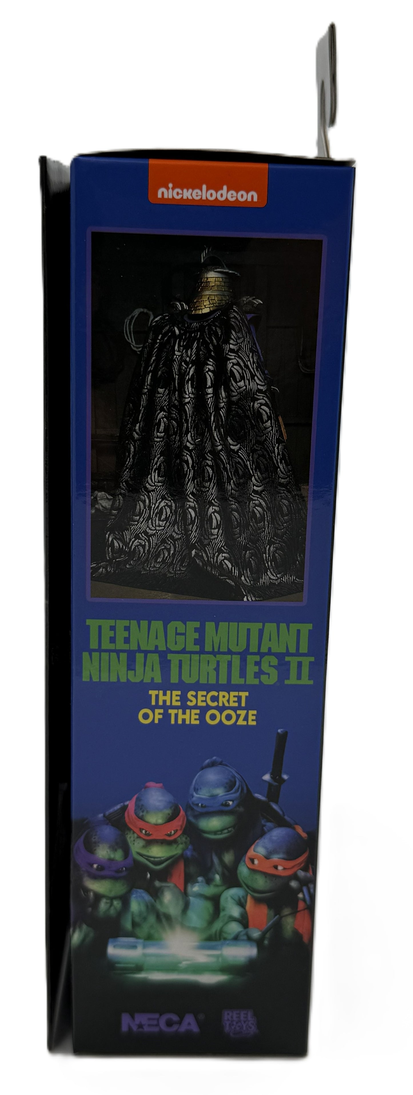 Side panel of the NECA Ultimate Shredder packaging featuring Teenage Mutant Ninja Turtles II The Secret of the Ooze artwork.