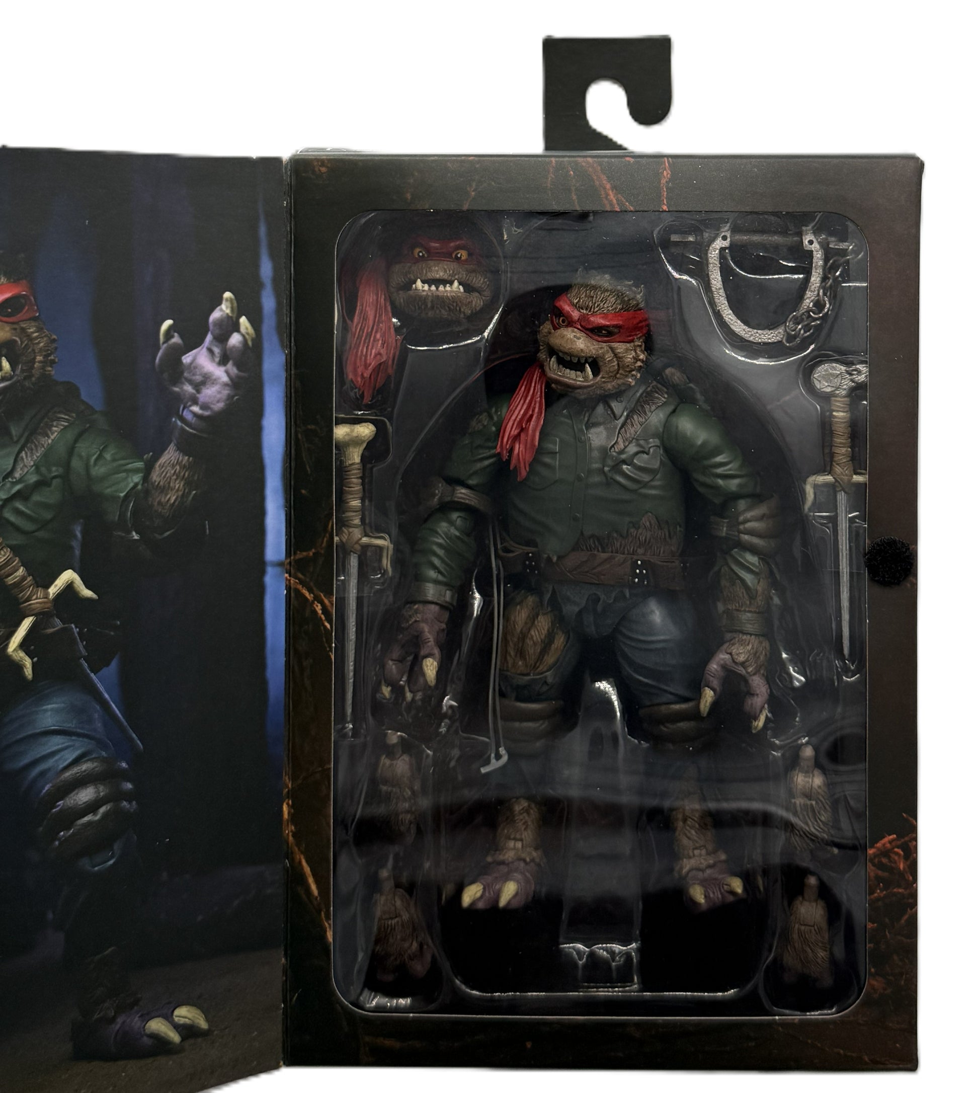 Close-up of the Raphael as The Wolf Man Ultimate Action Figure inside the collector window packaging with included accessories.