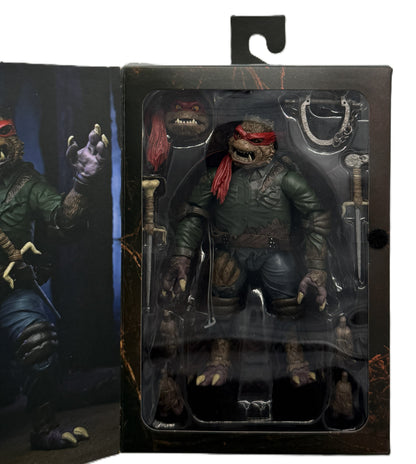 Close-up of the Raphael as The Wolf Man Ultimate Action Figure inside the collector window packaging with included accessories.