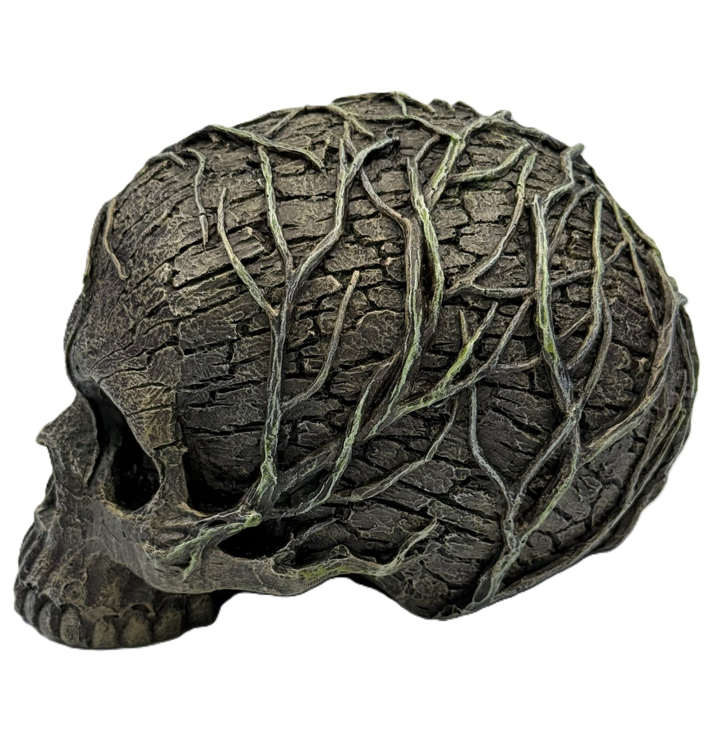 Left side view of skull statue featuring detailed bark texture and creeping vines wrapping across the surface

