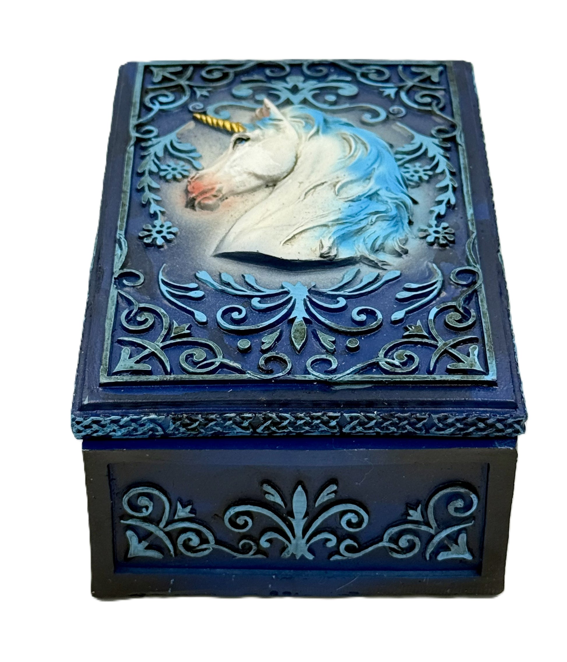 Front view of unicorn tarot box with ornate blue scrollwork and raised unicorn design
