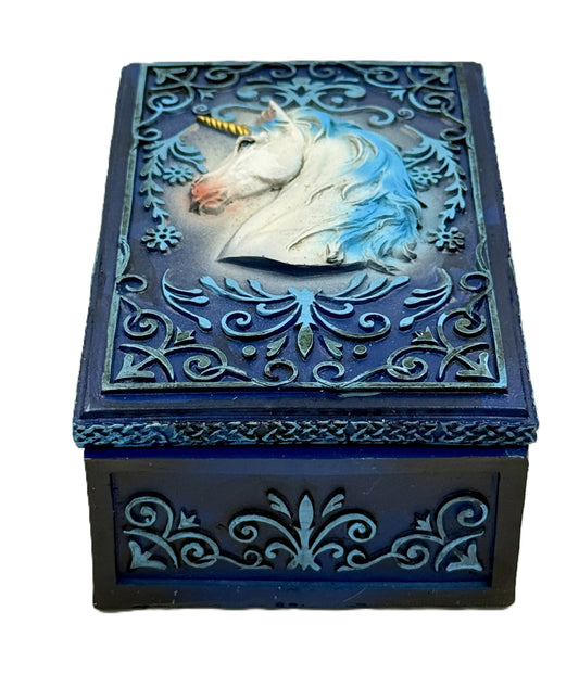 Front view of unicorn tarot box with ornate blue scrollwork and raised unicorn design
