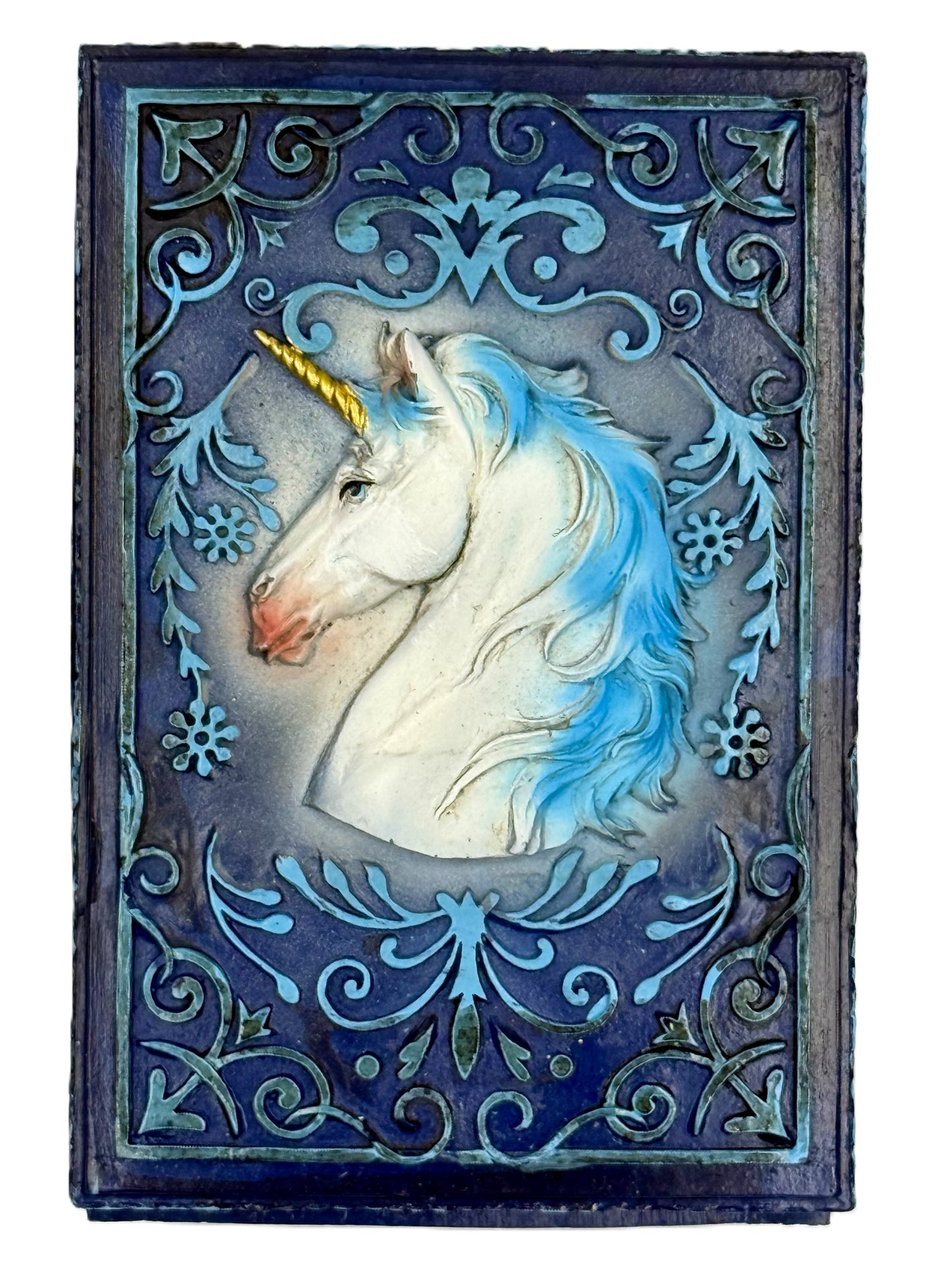 Top view showing detailed unicorn head and decorative border pattern
