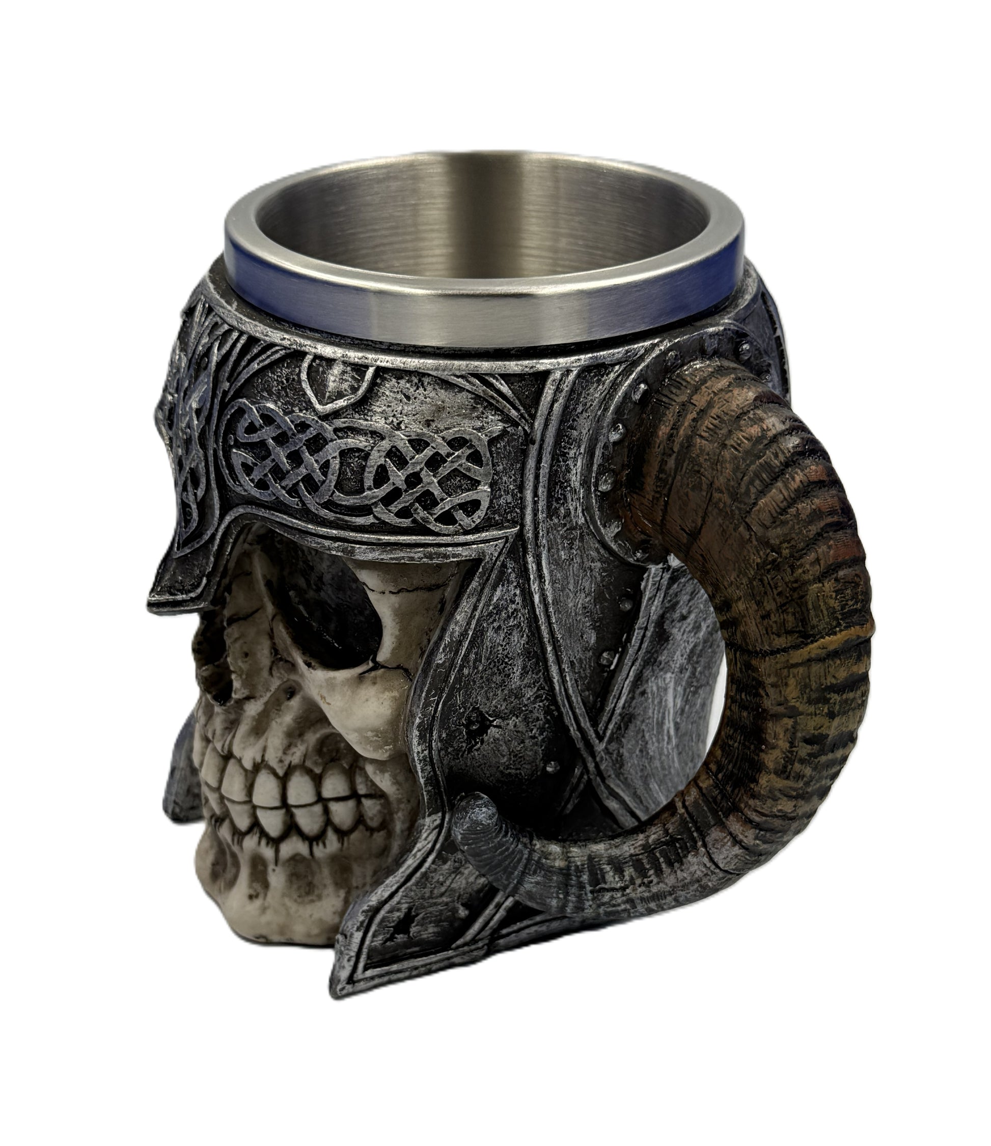 Side angled view of skull tankard showing horn handle and engraved Viking patterns with metallic interior

