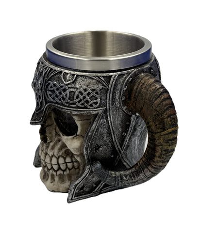Side angled view of skull tankard showing horn handle and engraved Viking patterns with metallic interior

