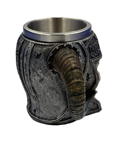 Side profile of skull mug featuring curved horn handle and rugged medieval design details
