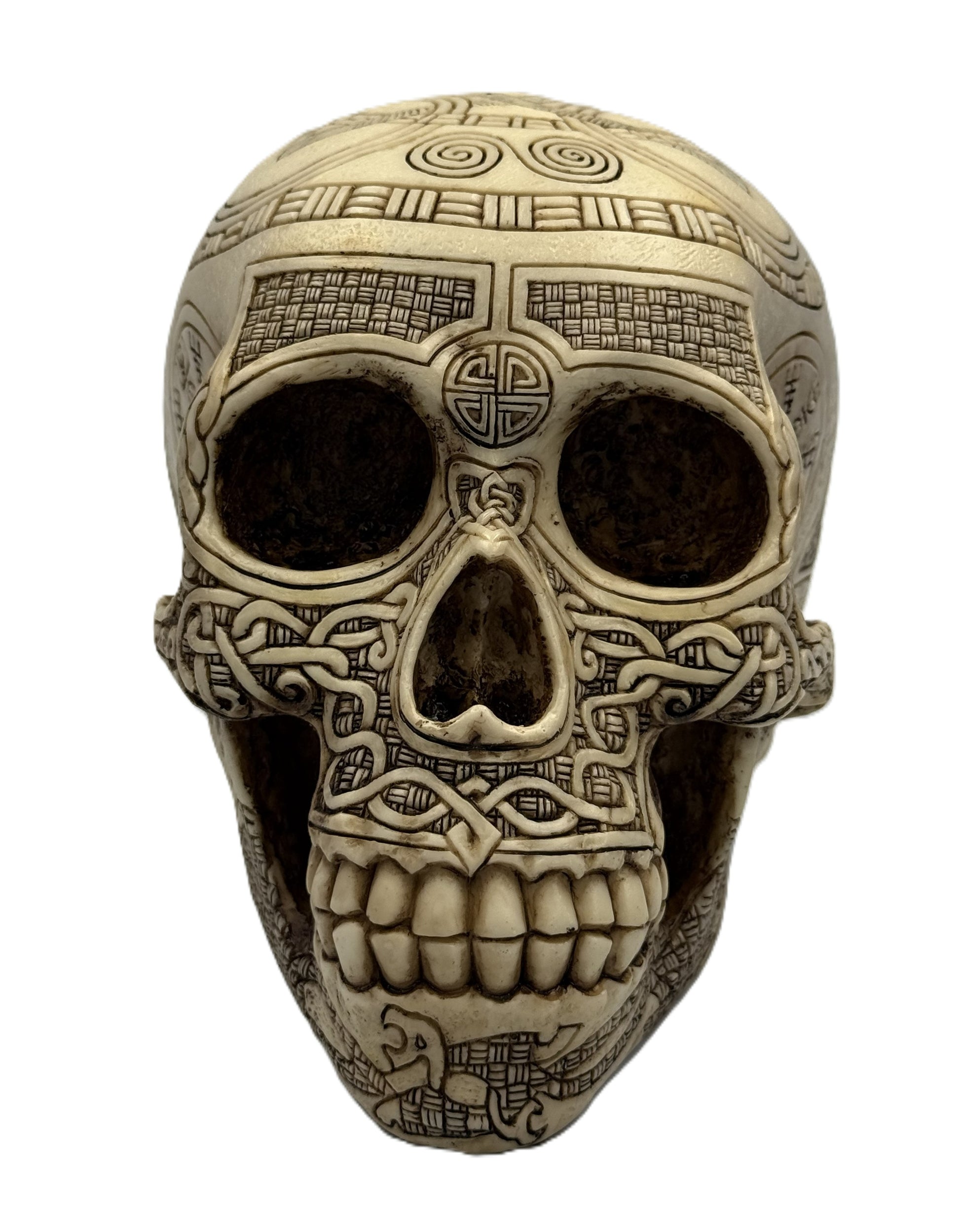 Front view of Viking skull statue with detailed teeth carving and symmetrical knotwork patterns
