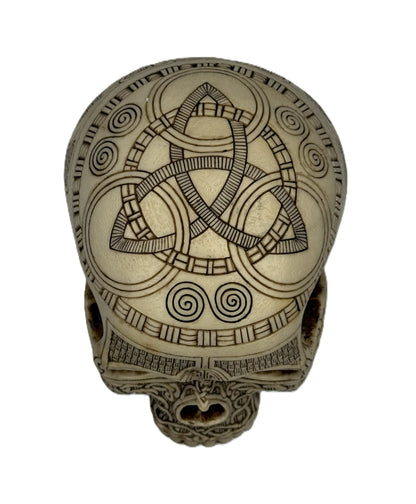 Top view of Norse skull decor featuring triquetra symbol and spiral carvings in hand painted resin
