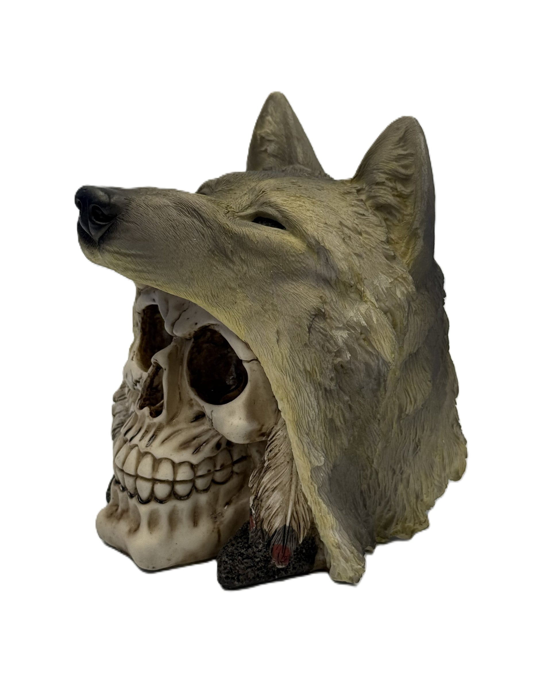 Side angled view of wolf skull figurine showing sculpted fur headdress and detailed skull features
